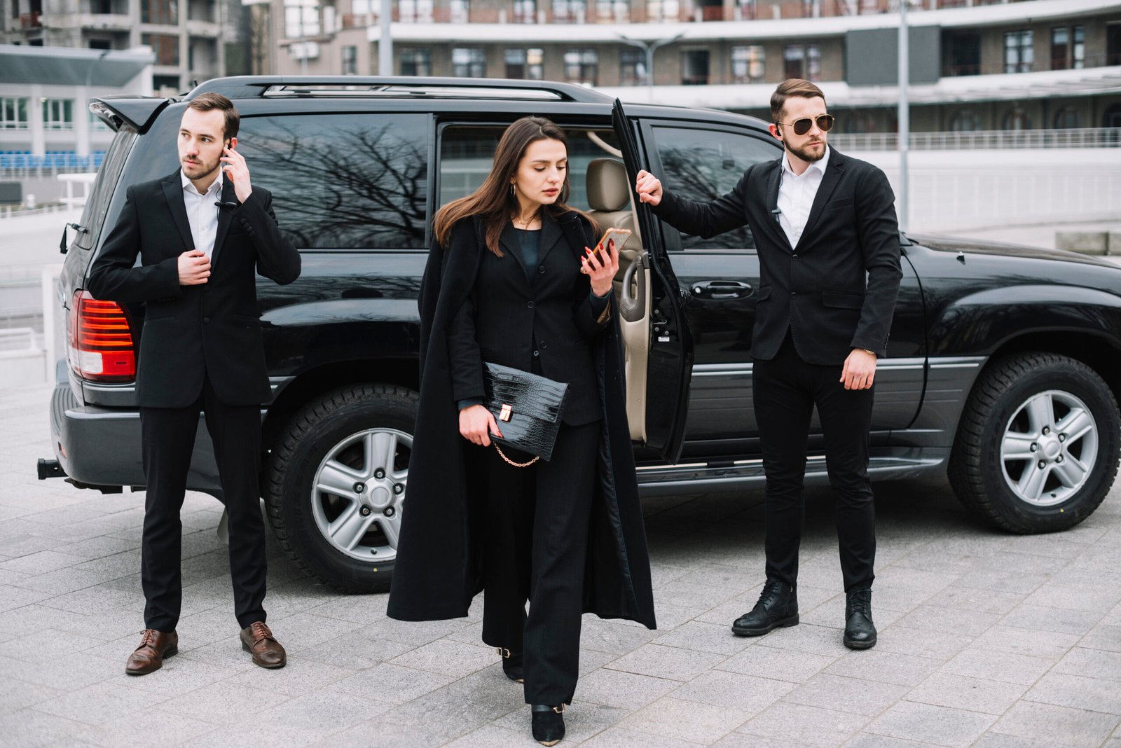 Luxury chauffeur service in London with professional drivers assisting a client arriving in style.