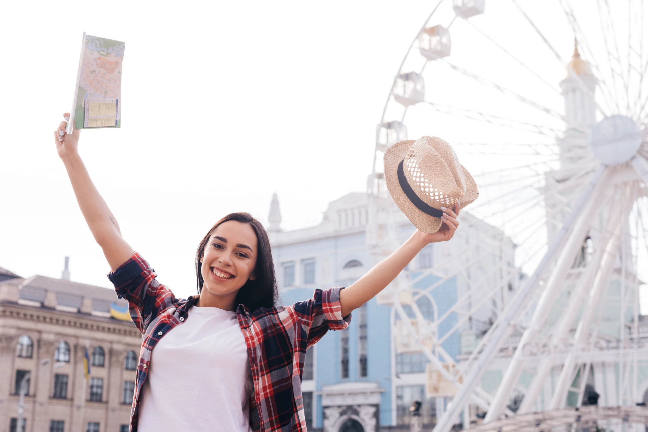 smiling-woman-raised-her-arm-with-holding-map-hat-standing-near-ferris-wheel-london-tour-scaled.webp